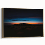 Framed canvas depicting Ayers Rock in Australia with a vintage poster style, featuring a black and colorful art palette.