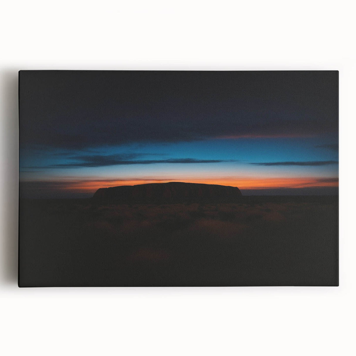 Large black and white print of Ayers Rock on stretched canvas, suited for kitchen wall art.