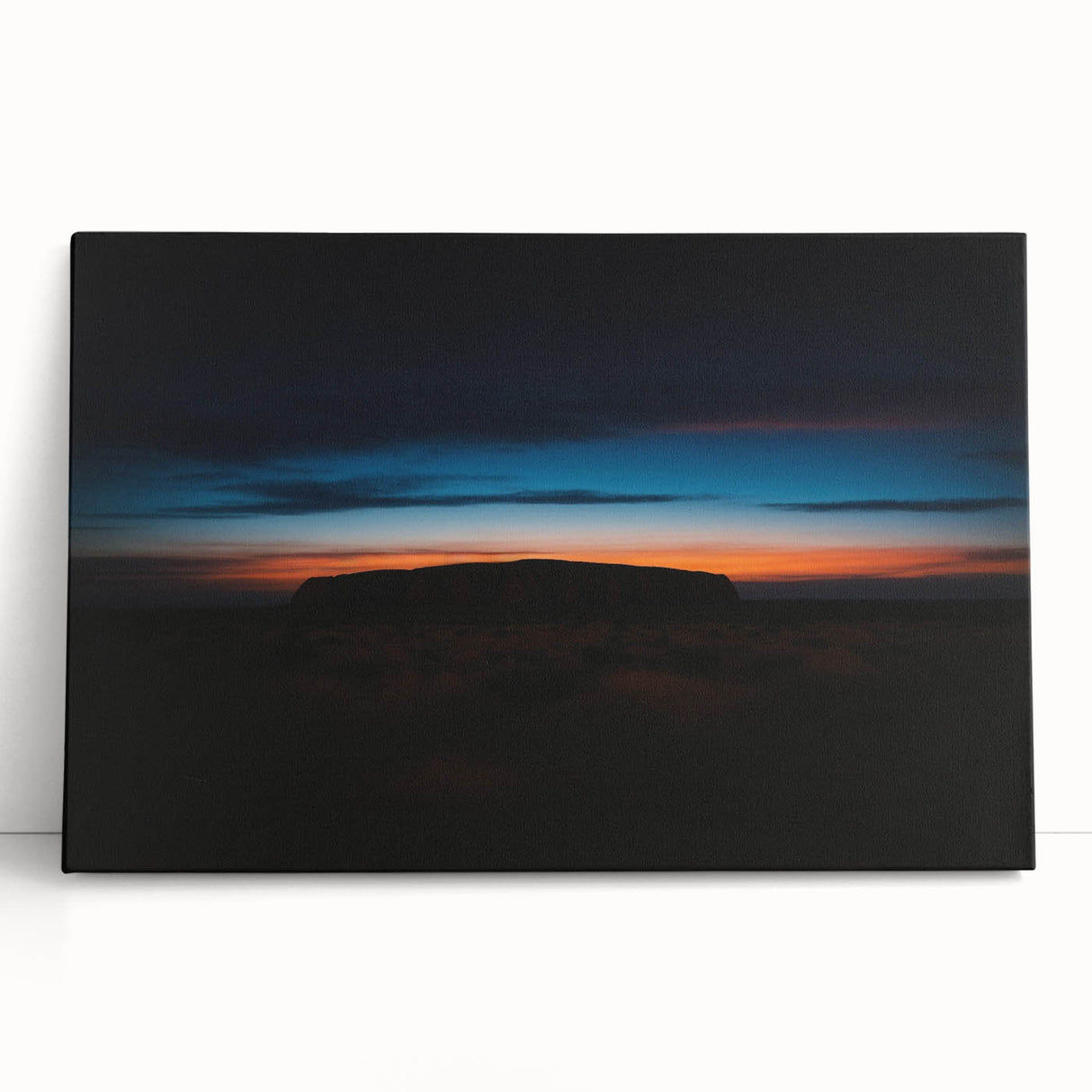 Large black and white print of Ayers Rock on stretched canvas, ideal for kitchen wall art or bedroom decor.