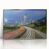 Framed acrylic print of Brisbane skyline in art deco style, featuring muted silver and blue tones.