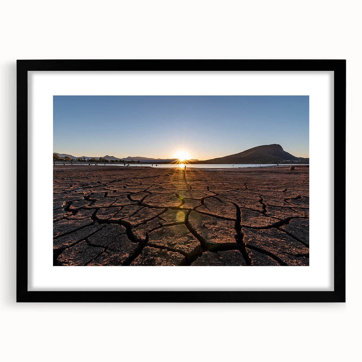Extra large abstract art print of colorful, textured scenery, framed in black, ideal for living room decor.