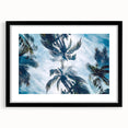 Colorful abstract art print of a Caribbean scenery in a black frame, ideal for living room decor.