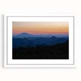 Abstract art print of Central American scenery in muted earth tones, framed with a white mat, suitable for dining room decor.