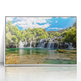 Mid-century modernist art depicting a Croatian coastal scene in muted blues and greens on a framed acrylic.