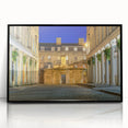 Large abstract wall art depicting a European scenery in muted earth tones on a framed acrylic.