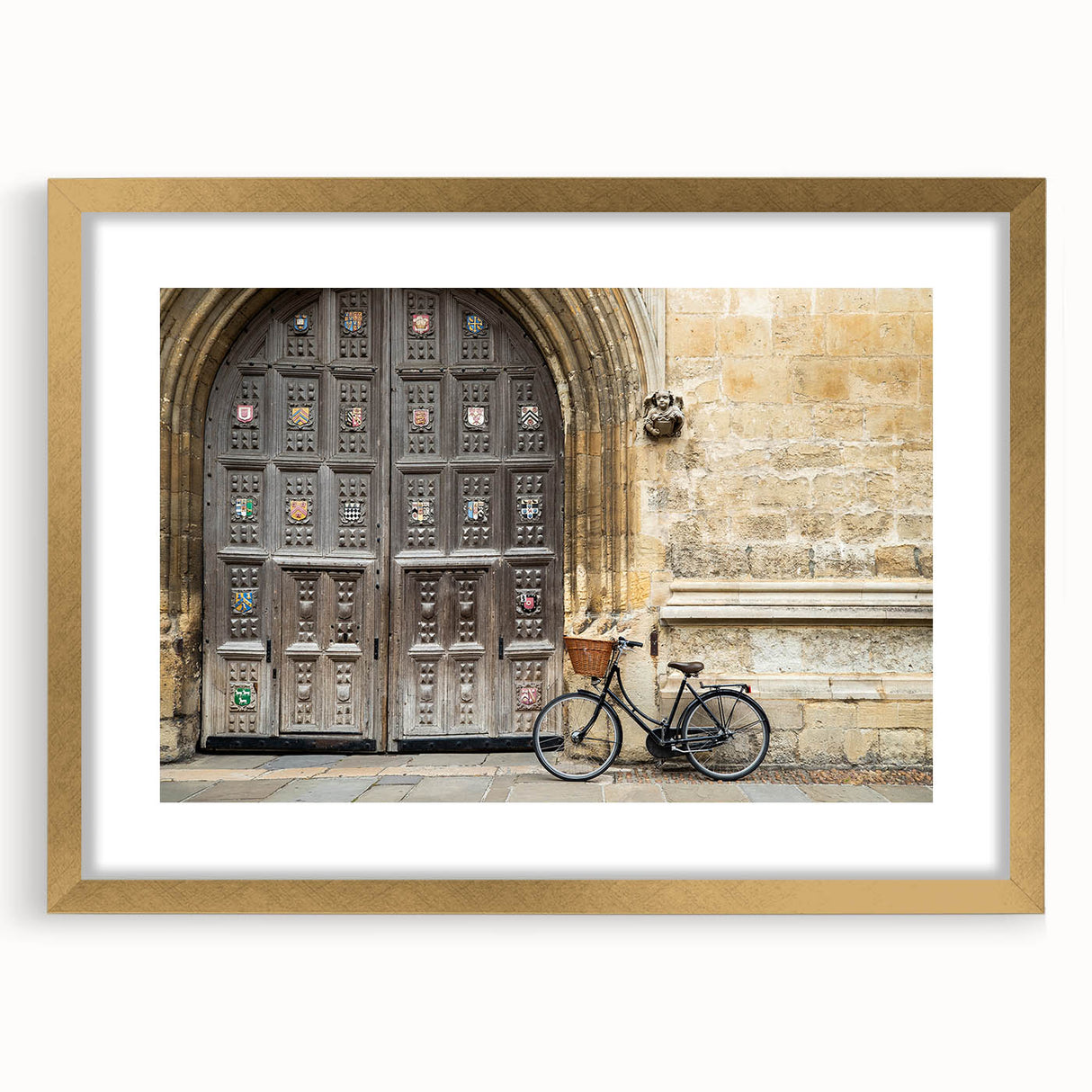 Abstract art print of Oxford scenery in muted earth tones on a gold-framed canvas, suitable for dining room decor.
