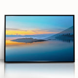 Large abstract wall art depicting a serene Finnish landscape in muted blue and green tones, framed in black acrylic.