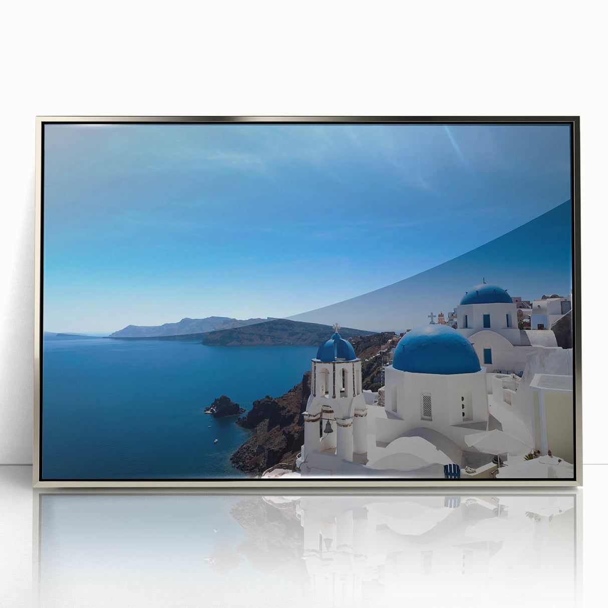 Framed acrylic print of Santorini, Greece with bright blue and white tones, ideal for modern art wall decor.