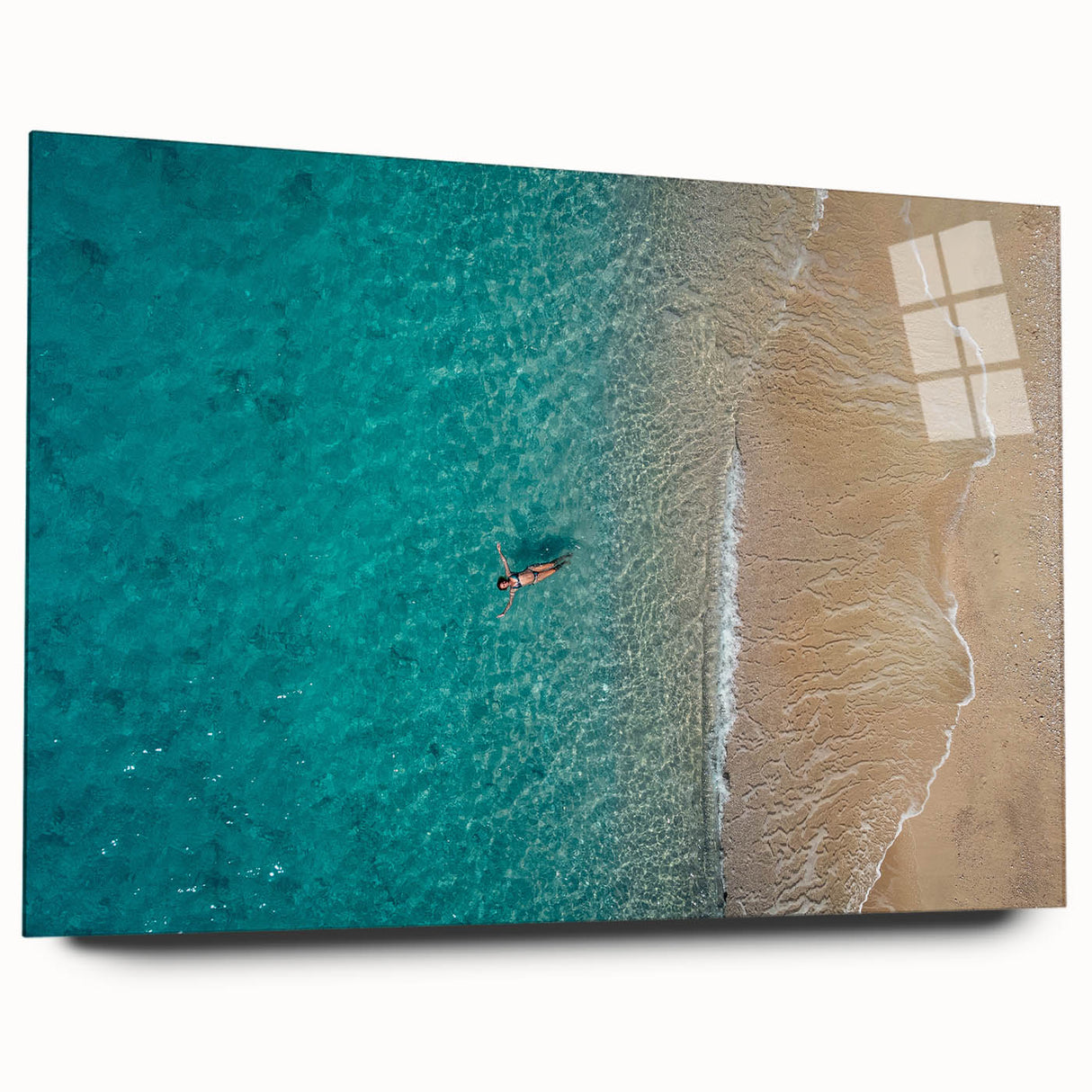Large abstract wall art of the Mediterranean Sea in muted blue and white tones on acrylic glass.