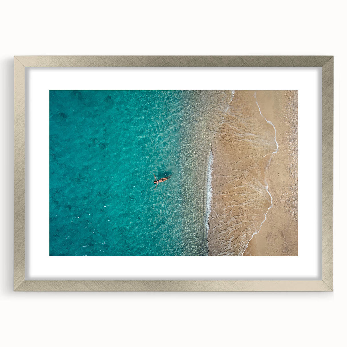 Extra large abstract art print of the Mediterranean Sea in muted blue and white tones, framed in silver.