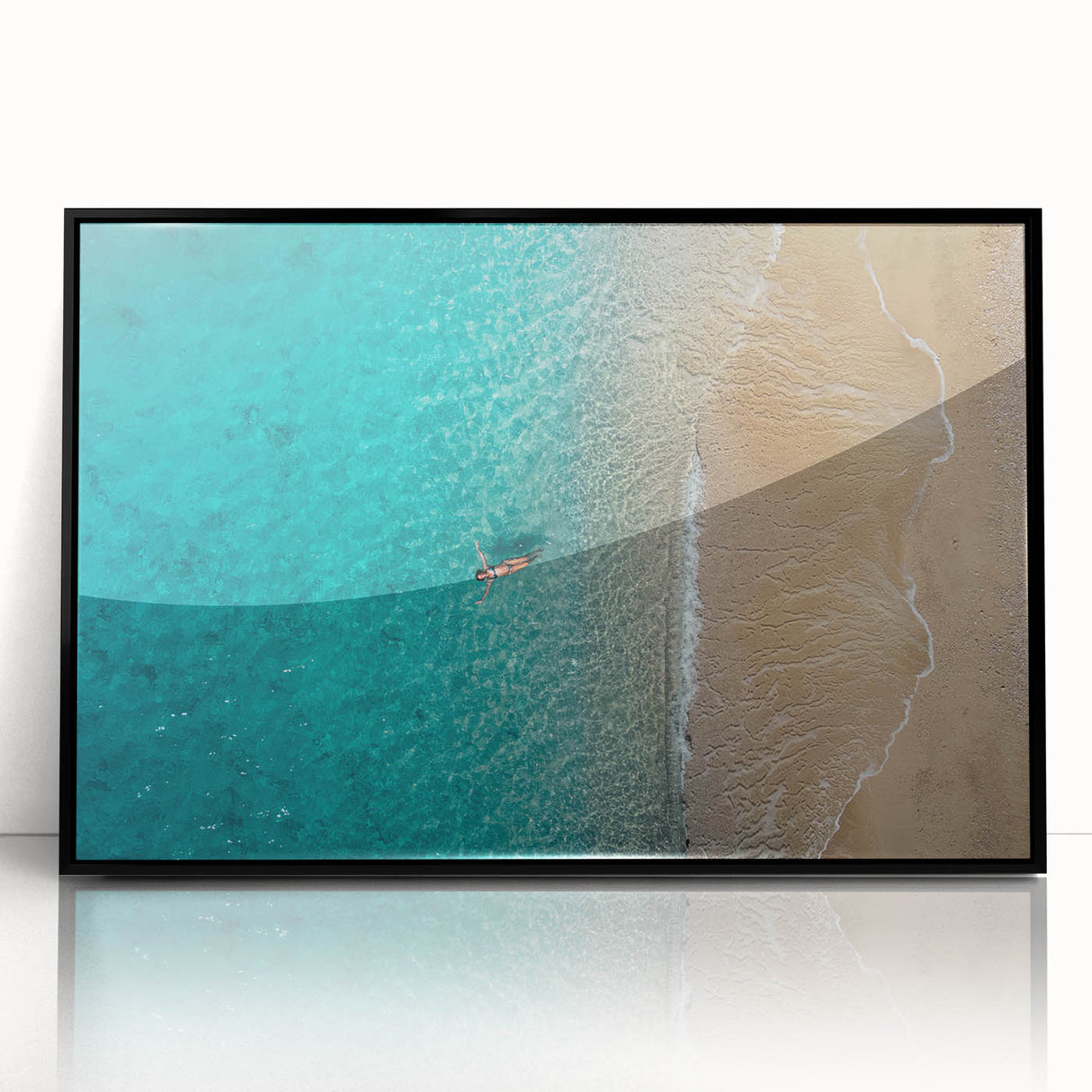 Large abstract wall art depicting the Mediterranean Sea in muted blue and white tones, framed in black acrylic.