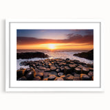 Textured art depicting abstract scenery of Northern Ireland in muted green and blue tones, framed with a white mat.