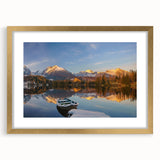 Abstract art print of a European landscape in muted earth tones on a framed gold canvas, suitable for dining room decor.