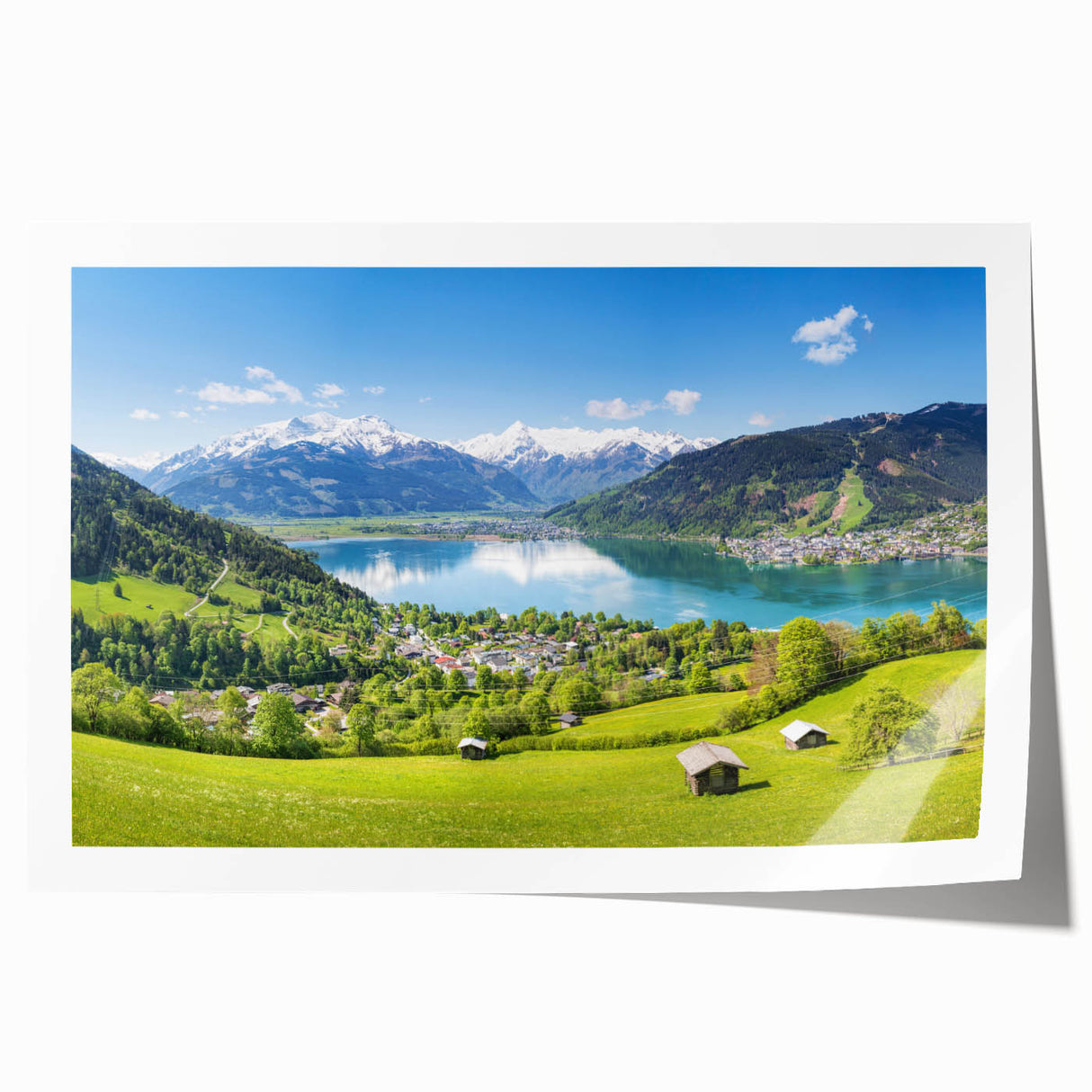 Rolled print of a Swiss landscape featuring lush green meadows and distant mountains, ideal for art wall dining room.