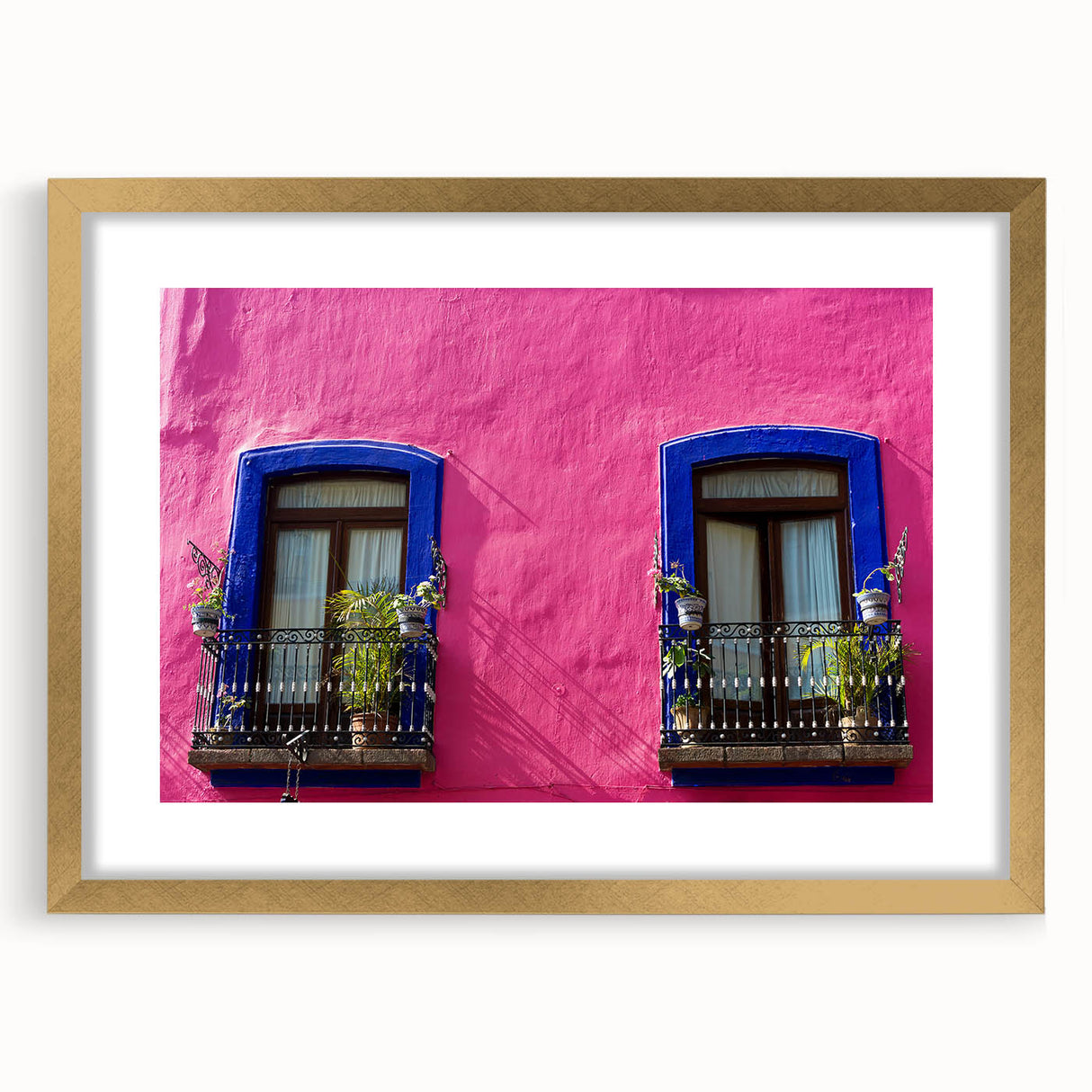 Abstract art print of Oaxaca scenery in textured style, featuring earthy tones on a gold-framed canvas.