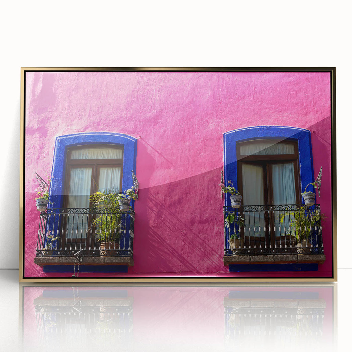 Framed acrylic print of a mid-century modernist Oaxaca scenery in gold and green tones, ideal for modern art wall decor.