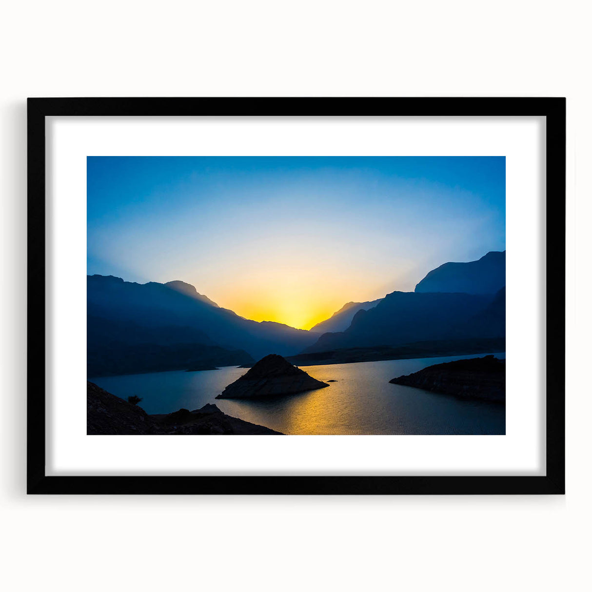 Extra large abstract art print depicting colorful, textured scenery of Middle East Oman, framed in black.
