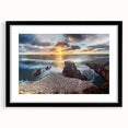 Abstract art print of New Zealand's west coast in vibrant colors on a large textured canvas, framed in black.