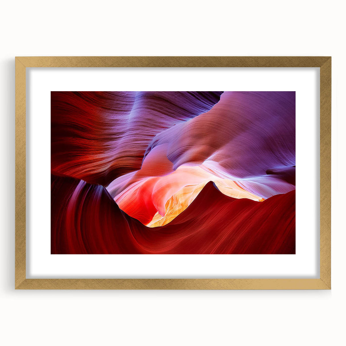 Extra large abstract art print of Arizona Antelope Canyon in gold frame, featuring textured red and orange hues.