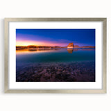 Textured abstract art print of Lake Powell in muted earth tones on a framed silver mat, suitable for bedroom art.