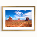 Extra large wall art featuring an abstract print of Monument Valley in textured colors of red and orange, framed in gold.
