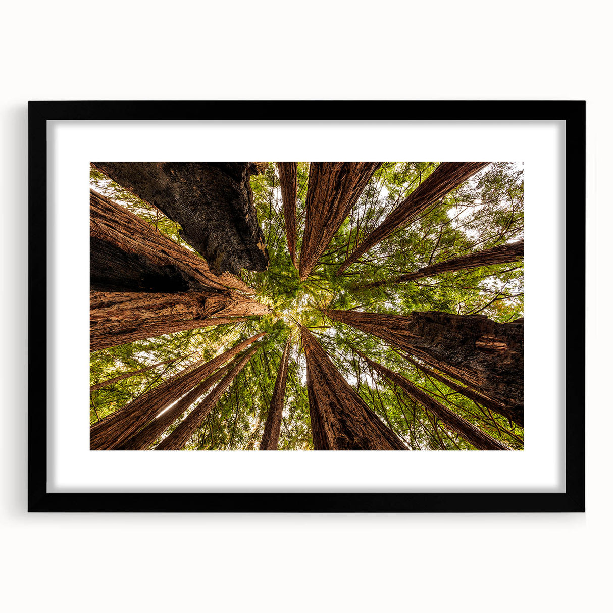 Colorful abstract art print of Big Sur in vibrant hues on a large, textured canvas, framed in black.