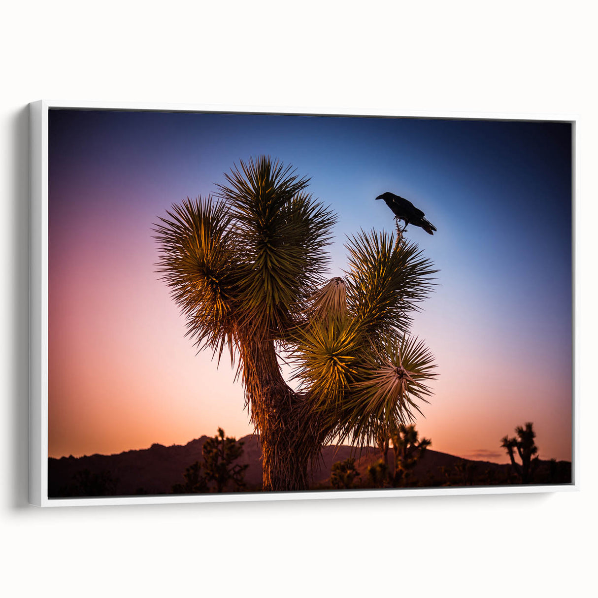 Vintage poster art of Joshua Tree on a framed canvas, featuring muted earth tones, ideal for living room decor.