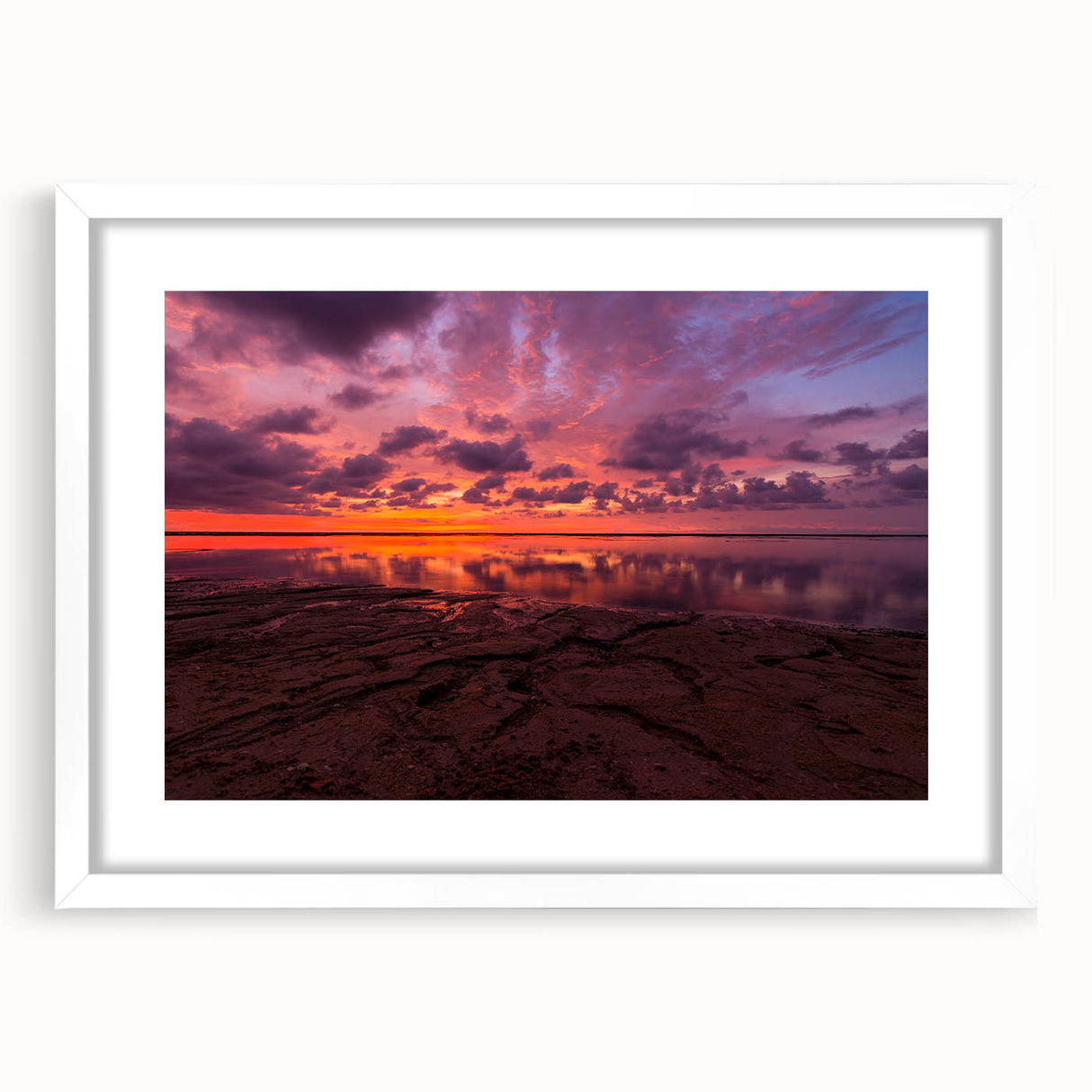 Abstract art print of Santa Cruz with vibrant blue and green tones on a white-framed mat, ideal for dining room decor.