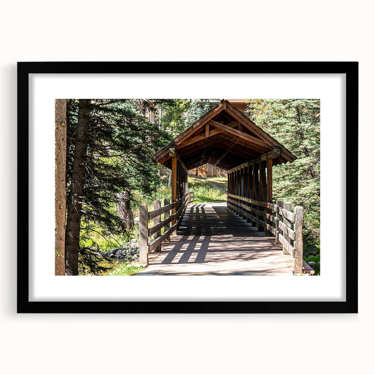 Abstract art print of a textured, colorful landscape, featuring earth tones and blues on a large framed canvas.