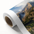 Art deco style poster of the Rocky Mountains in muted earth tones on rolled canvas, ideal for nursery wall art.