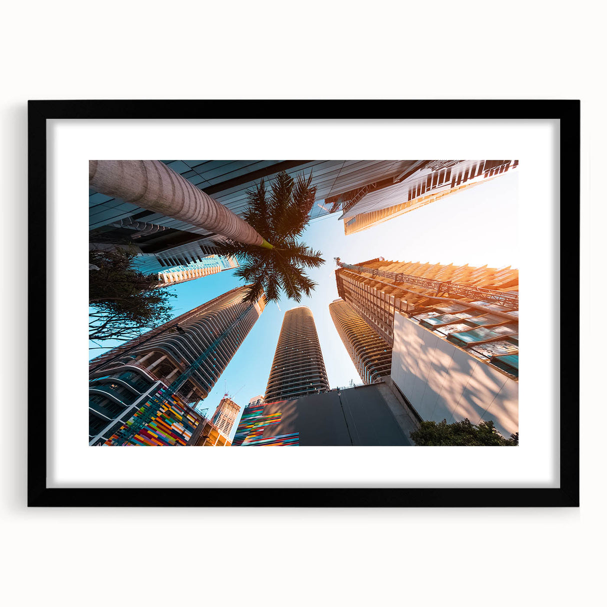 Extra large abstract art print of colorful Miami scenery on textured canvas, framed in black, ideal for living room decor.