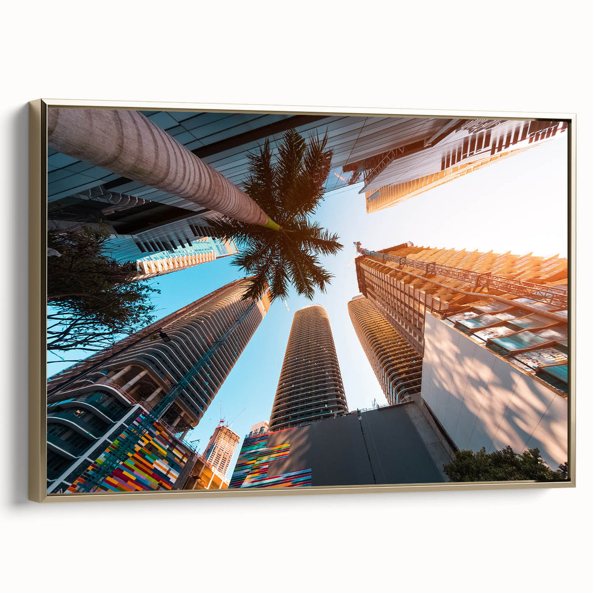 Framed canvas depicting a vintage-style Miami landscape with black and gold tones, ideal for bedroom wall art.