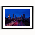 Abstract art print of Atlanta skyline in vibrant colors on a large textured canvas, ideal for living room decor.