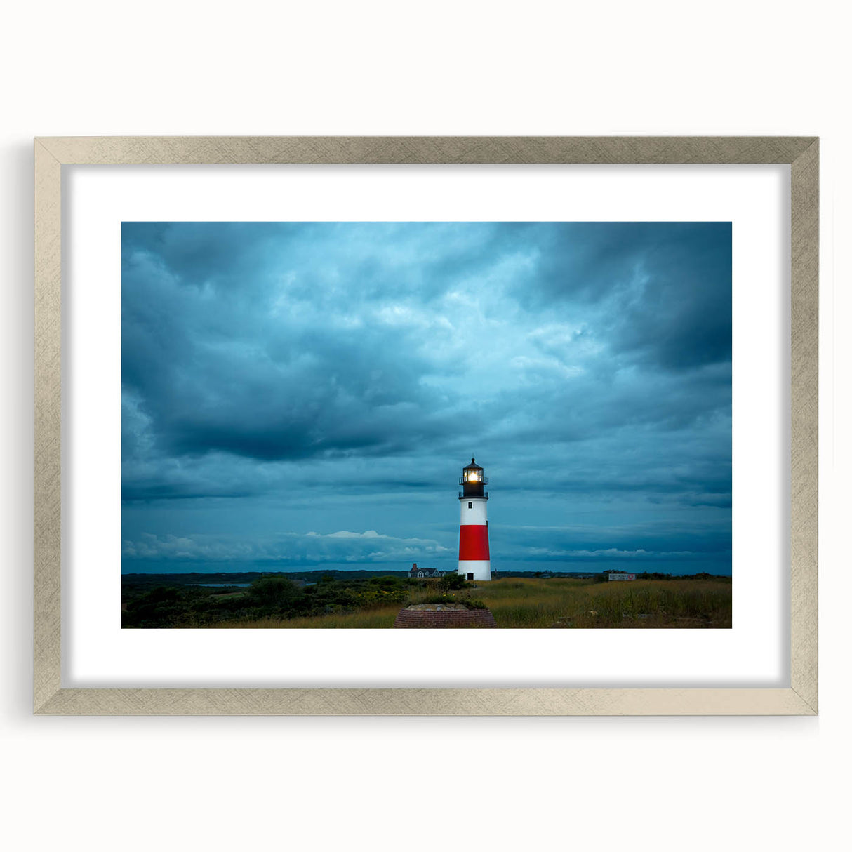 Textured art print depicting abstract scenery of Nantucket in muted blue and gray tones, framed in silver.