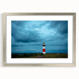 Textured art print depicting abstract scenery of Nantucket in muted blue and gray tones, framed in silver.