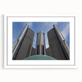 Abstract art print of Detroit skyline in muted gray and blue tones on a framed white mat, ideal for dining room decor.