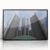 Large abstract wall art depicting Detroit skyline in muted gray and blue tones, framed in black acrylic.