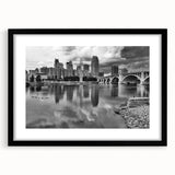 Extra large abstract art print of a colorful, textured Minneapolis skyline, in a black frame with mat.