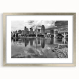 Textured abstract art print of Minneapolis skyline in muted gray and silver tones on a framed canvas.