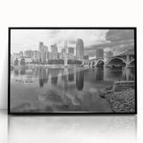 Large abstract wall art of Minneapolis skyline in muted gray and blue tones on framed acrylic, ideal for modern office decor.