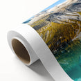 Art deco poster of Montana's Glacier scenery on rolled canvas, in soft blue and white tones, ideal for nursery wall art.