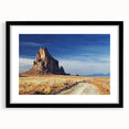 Colorful abstract art print of White Sands, New Mexico, in vibrant hues on a large textured canvas, framed in black.