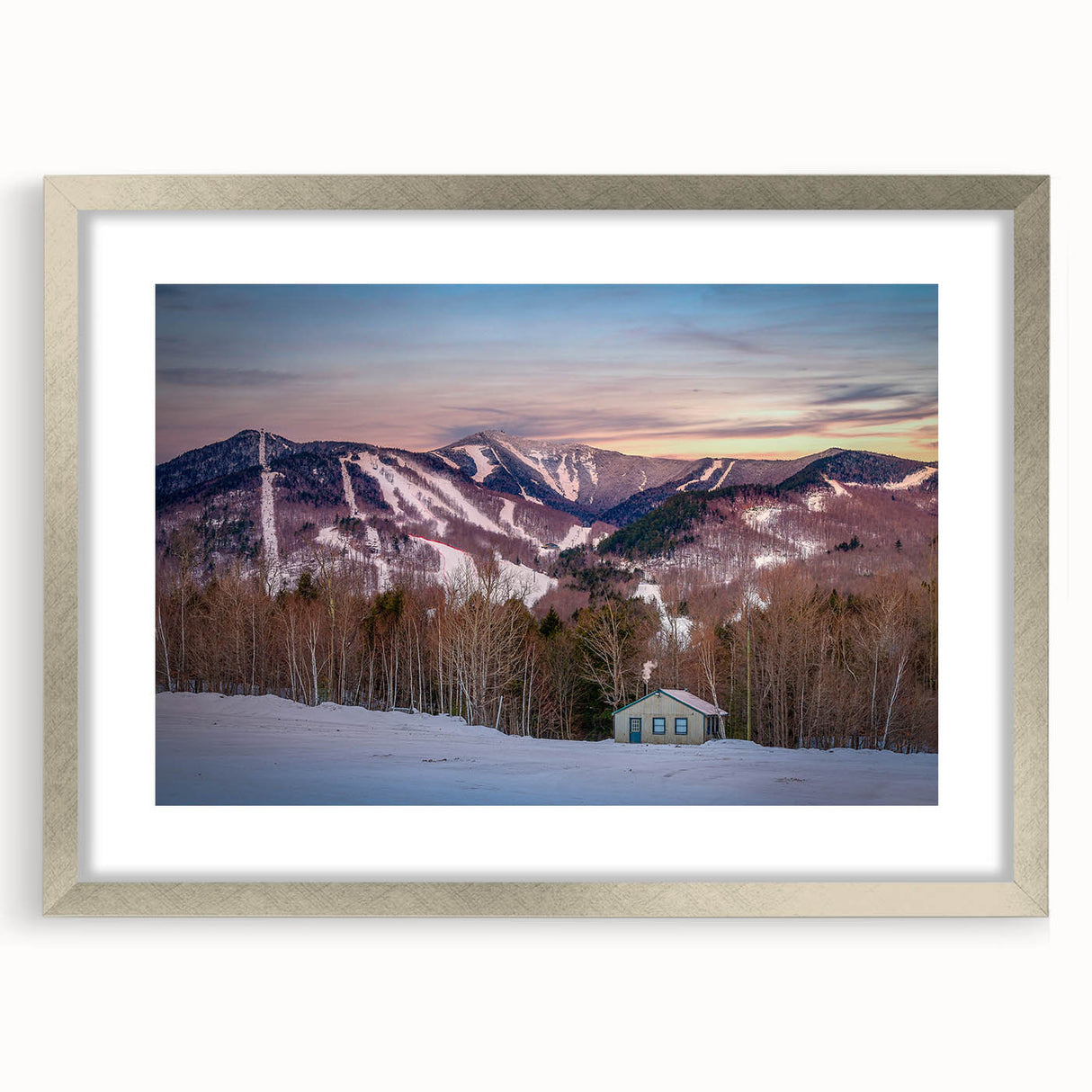 Textured abstract art print of Adirondacks scenery in muted earth tones, framed in silver, suitable for bedroom decor.