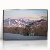 Mid-century modernist art depicting the Adirondacks in muted earth tones on a silver-framed acrylic.