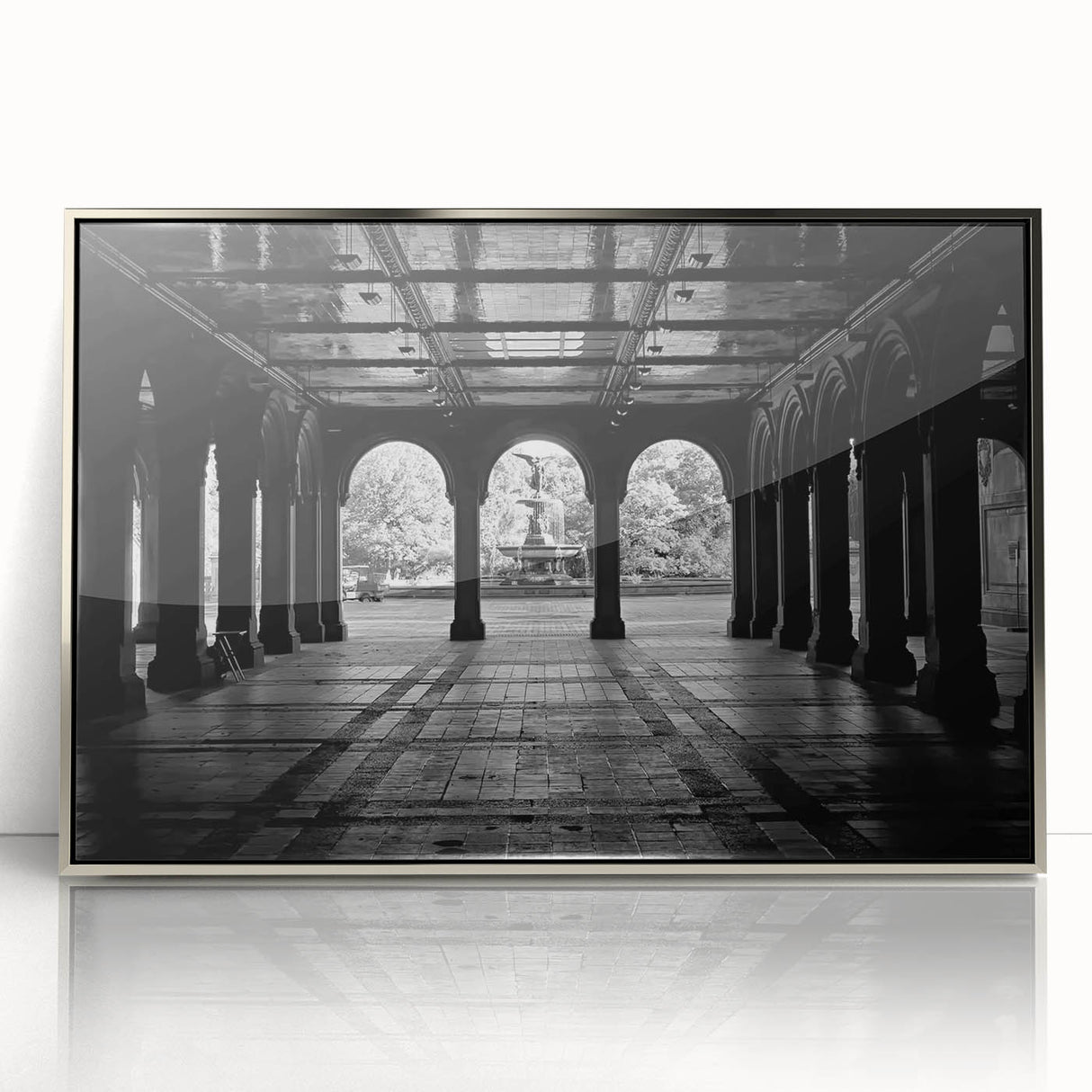 Mid-century modernist art depicting Central Park in muted green and gray tones on a silver-framed acrylic print.