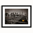 Extra large abstract art print of colorful Manhattan skyline on textured canvas, framed in black.