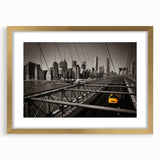 Extra large abstract art print of Manhattan skyline in textured gold frame, ideal for living room decor.