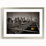 Textured art of abstract Manhattan skyline in muted grays and blues, framed in silver, ideal for bedroom decor.