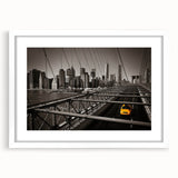 Abstract art print of Manhattan skyline in muted gray and blue tones on a white framed poster, ideal for dining room decor.