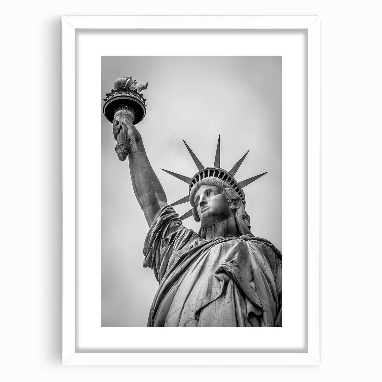 Textured art print of the Statue of Liberty in abstract style with muted green and blue tones on a framed white mat.